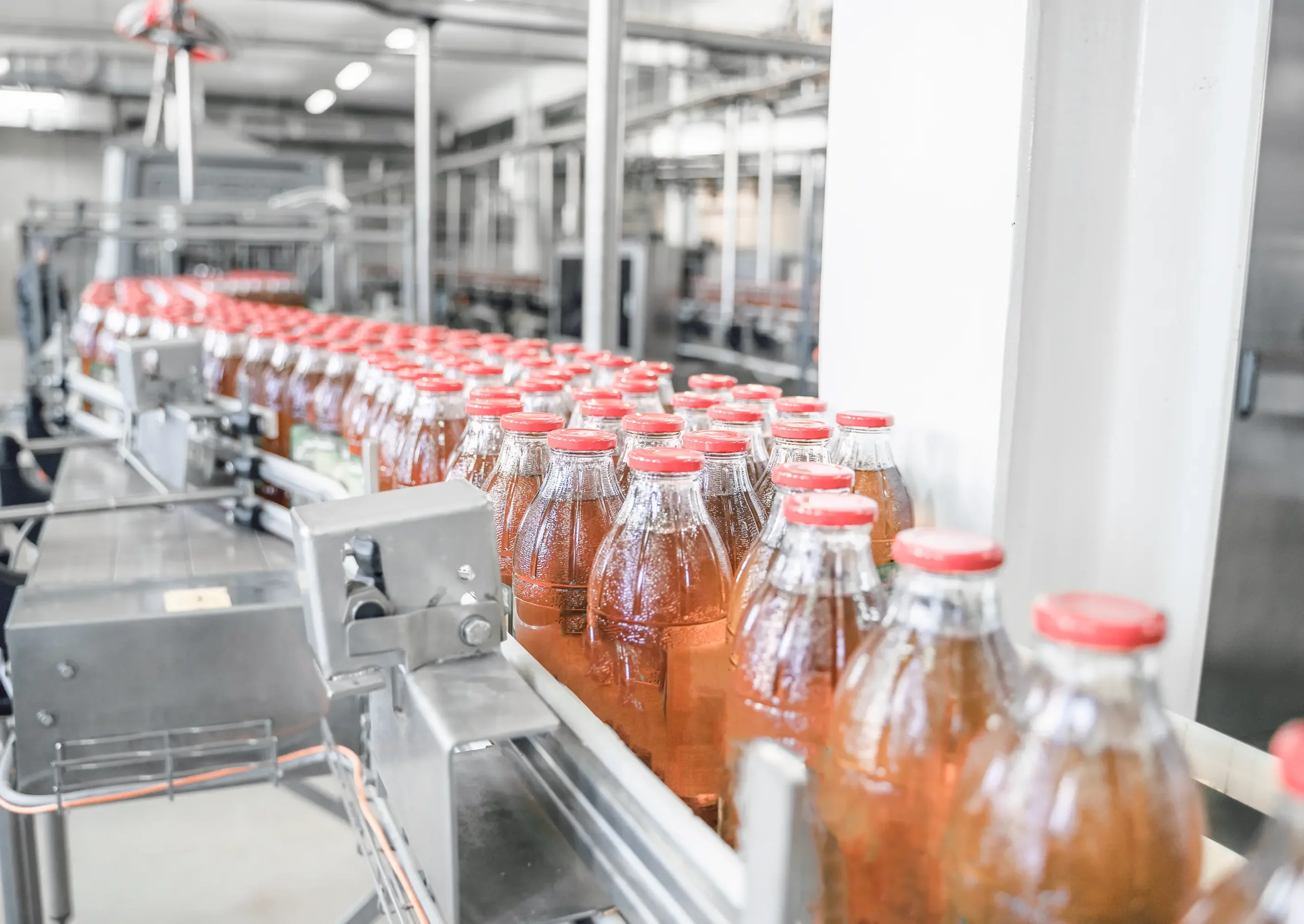 Typical industrial blower application: blow off water droplets with an air knife on bottles
