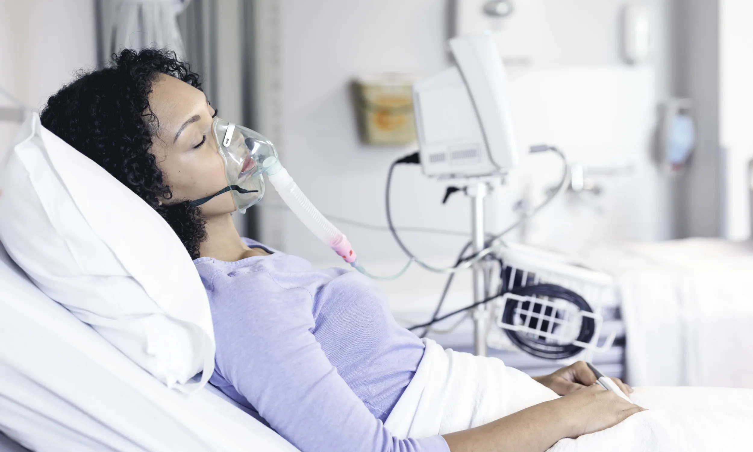 Typical blower application: Woman in hospital bed with medical breathing ventilator